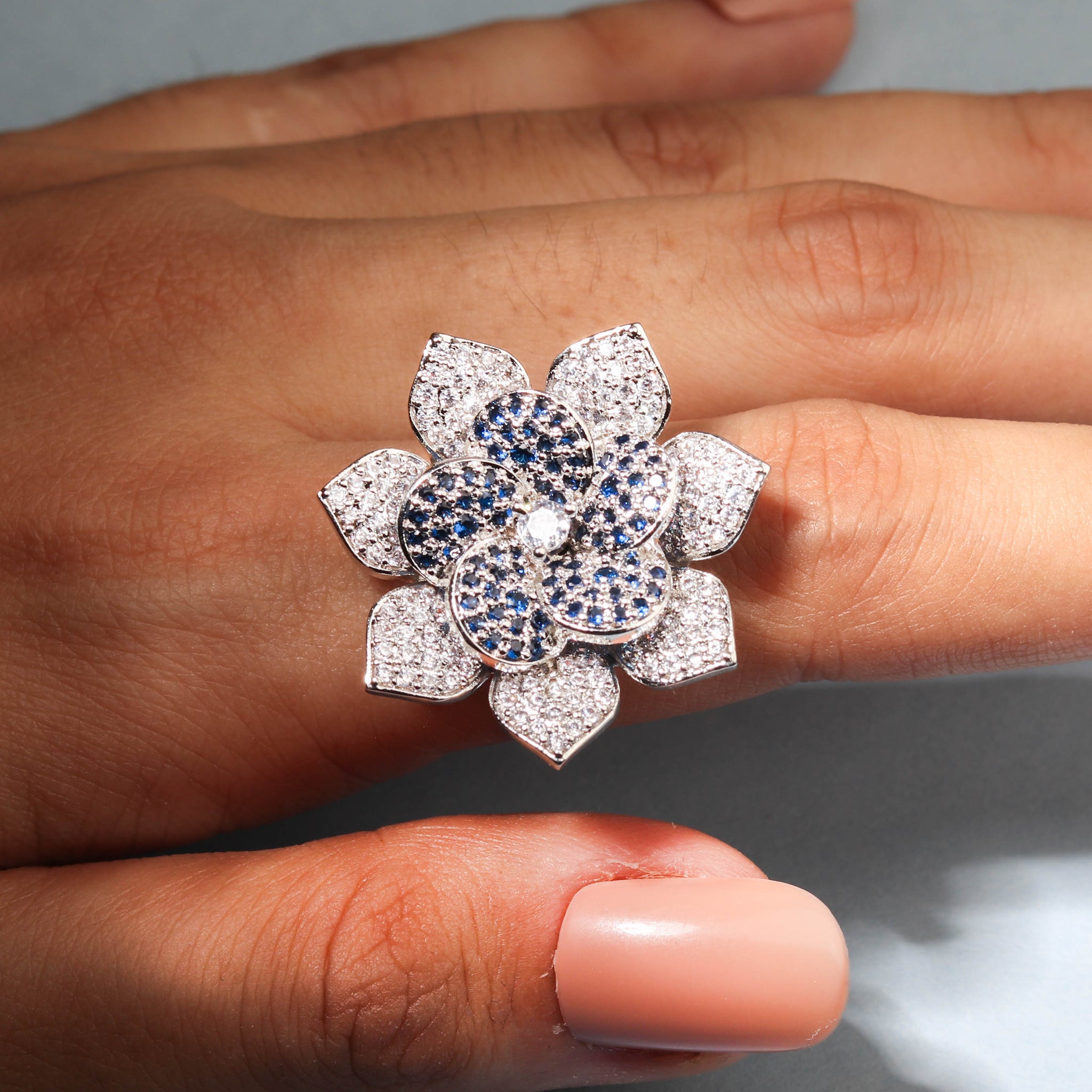 Elegant Flower Shaped Finger Ring With Blue Stones For Women - Free Size