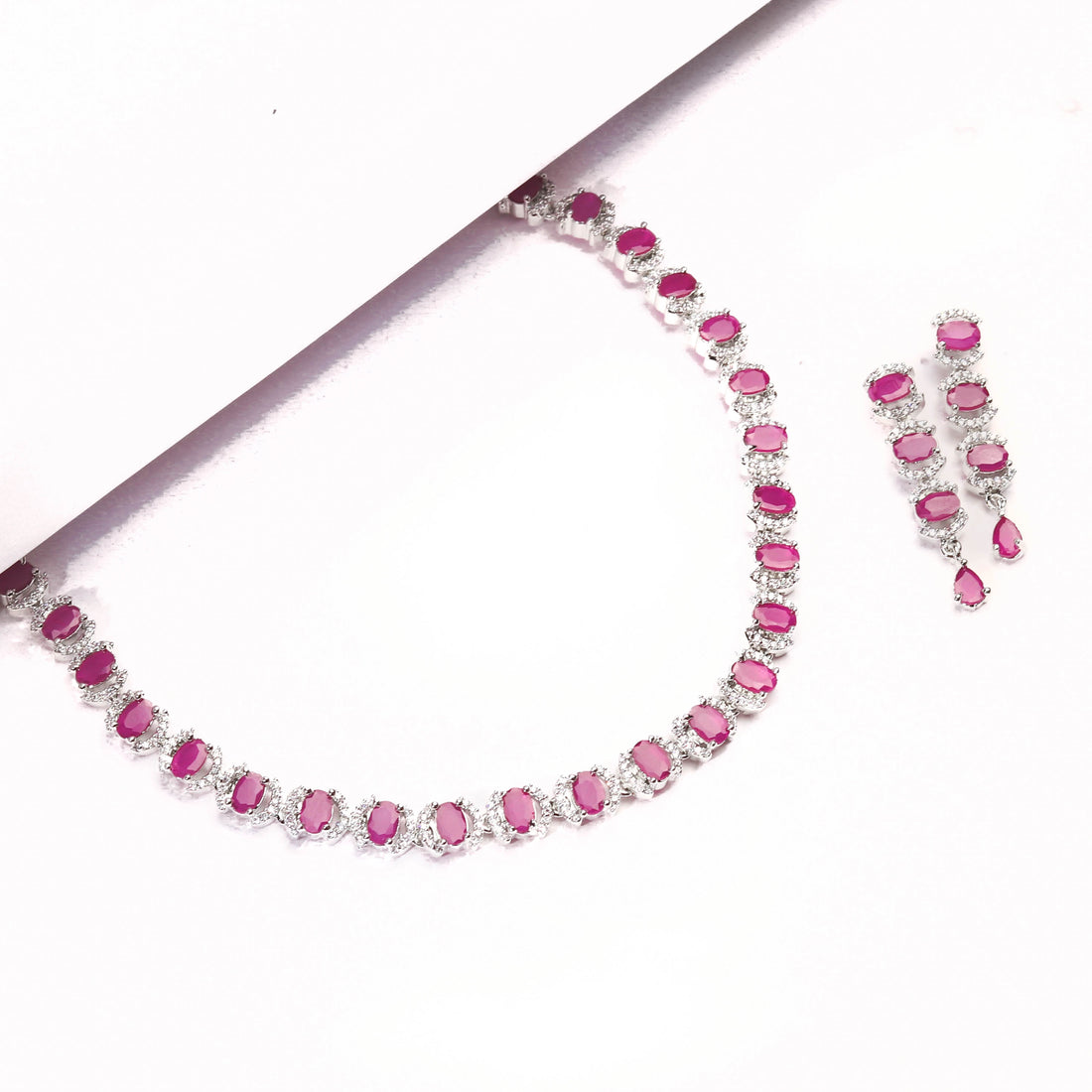 Rhodium Plated Beautiful Necklace Set With Pink Stones And Pair Of Earrings