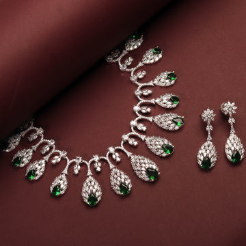 Rhodium Plated Elegant Nature Inspired Necklace Set With Ruby Color Green Stones And Earrings