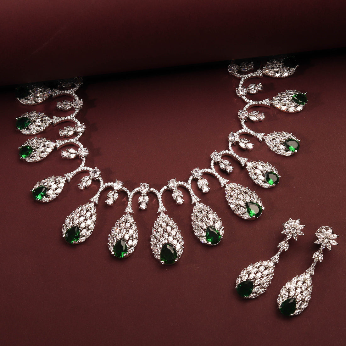 Rhodium Plated Elegant Nature Inspired Necklace Set With Ruby Color Green Stones And Earrings