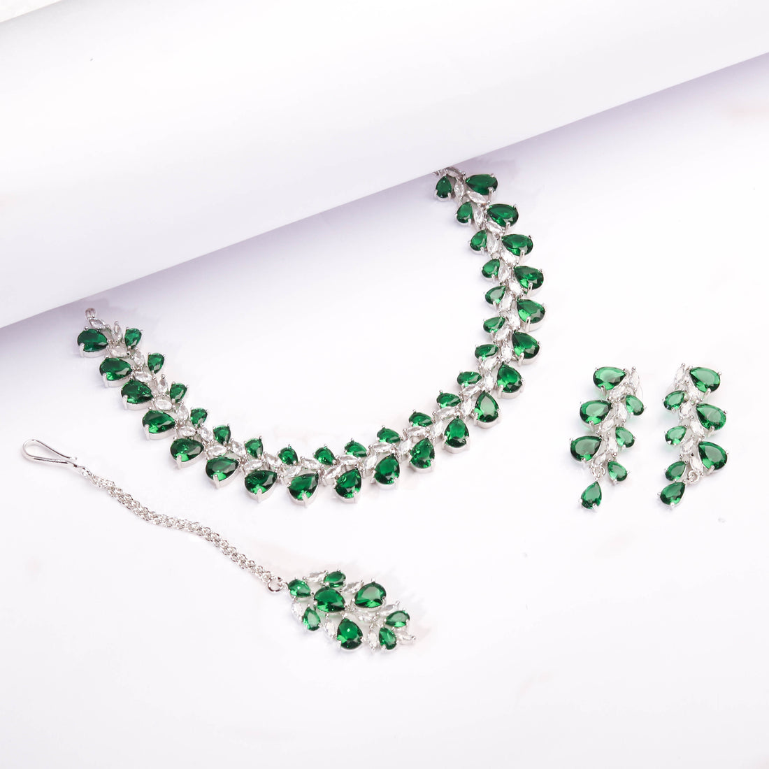 Rhodium Plated Luxurious Emerald Green Color Necklace Set With Earrings And Maang Tikka