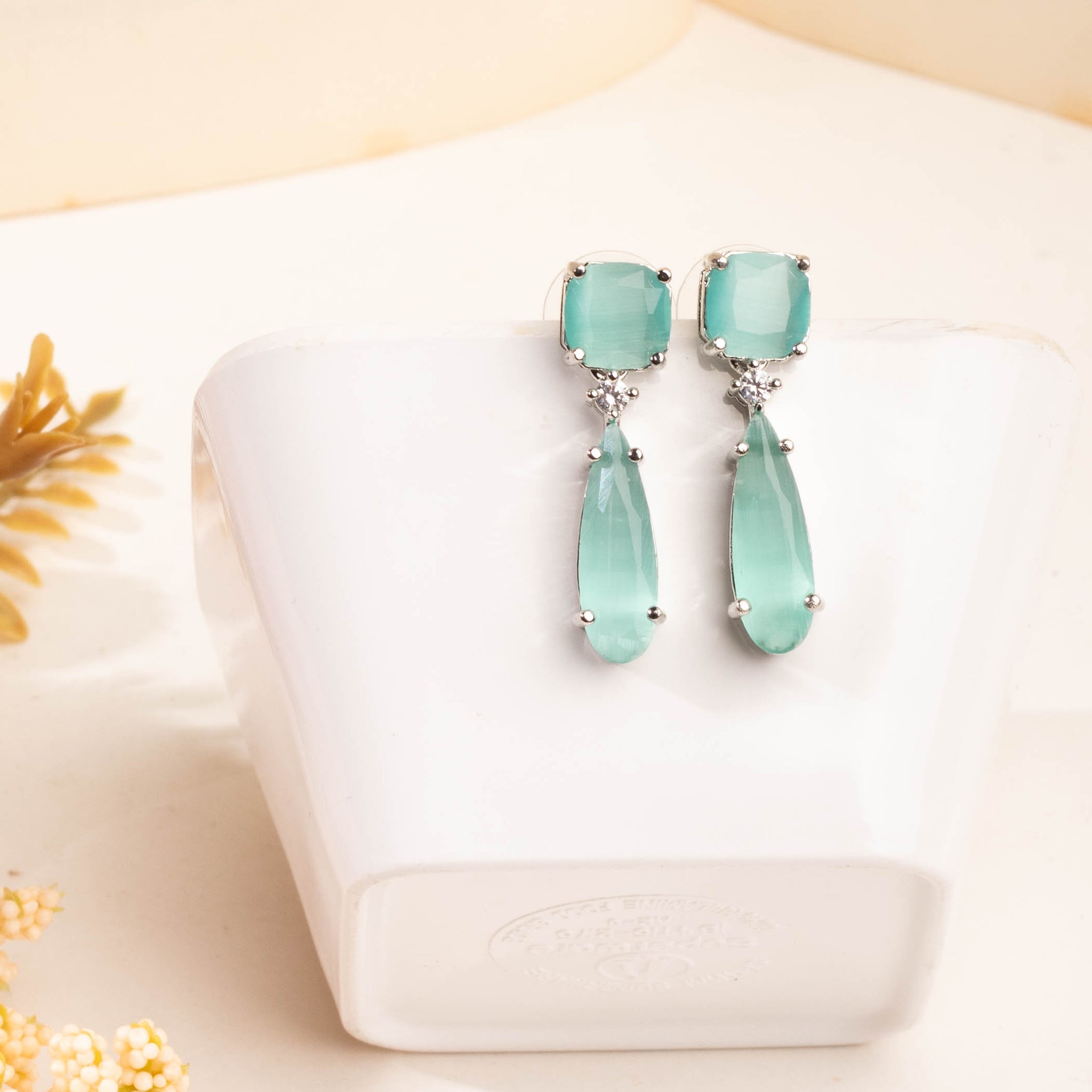 Magnificent Rhodium Plated Aquamarine Studded CZ Drop Earrings For Women